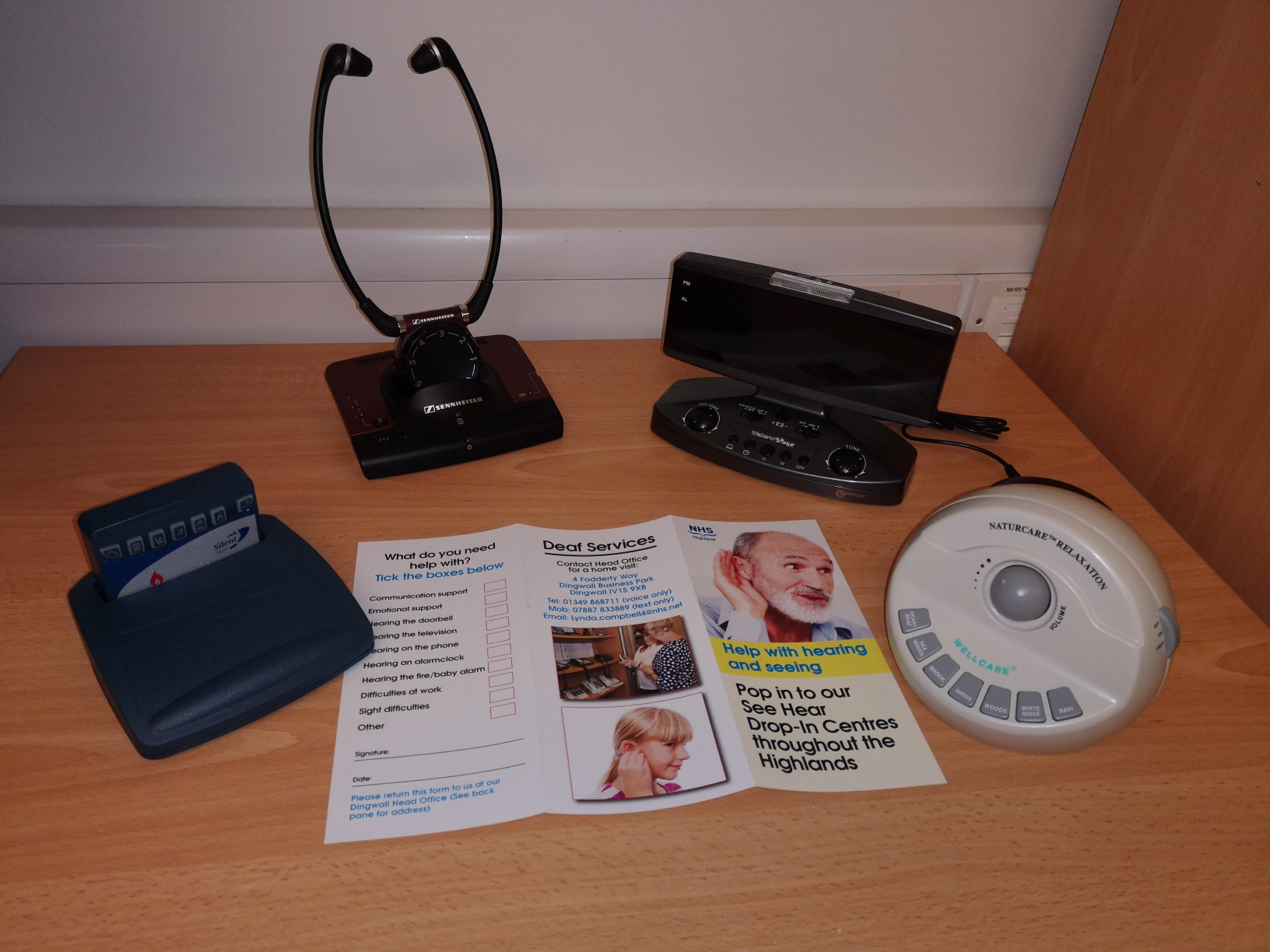 image of devices and leaflets to support people with a hearing loss